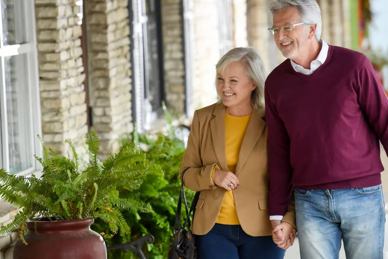 Elderly couple on a shopping trip.