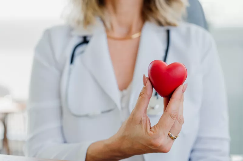 Doctor holding a red heart