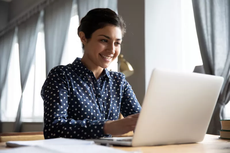 A woman using a laptop computer. 