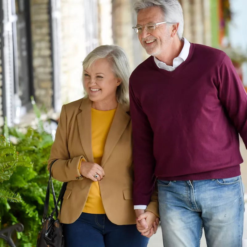 Elderly couple on a shopping trip.