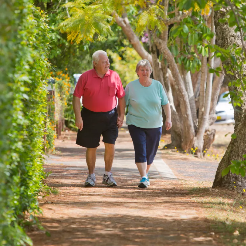 Man and woman walking outside.