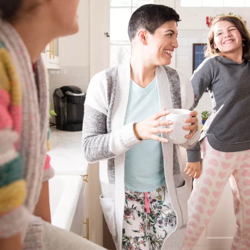 Three women's generations having fun in the kitchen