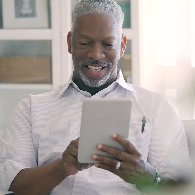 Man on a video call with his physician.