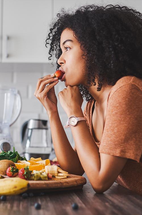 A woman eating healthy.